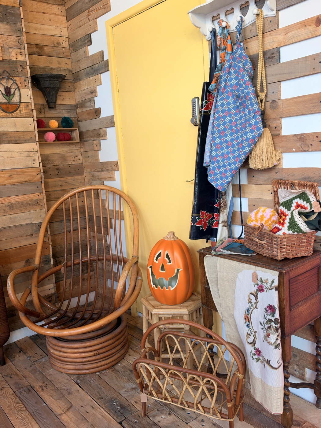 A rattan chair, a pumpkin and a basket in the vintage corner